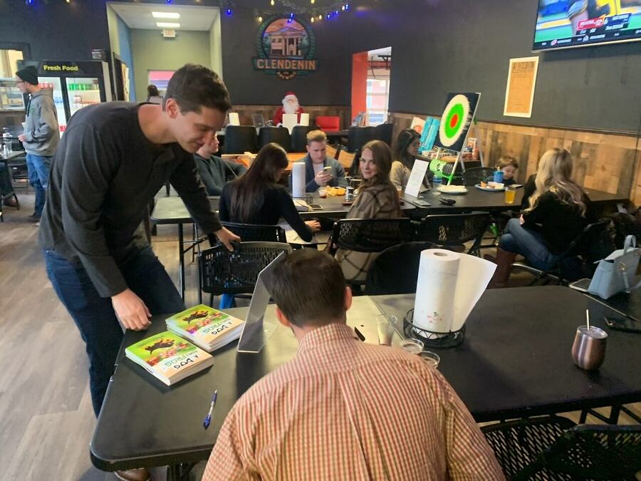 A lively A Dog Named Frog community book signing